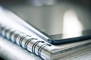 a paper book and an ipad